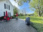 Stamped concrete patio overlooking the sprawling yard